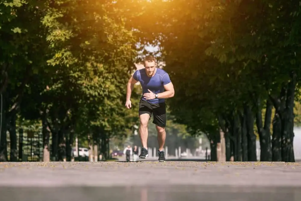 A smoker-turned-non-smoker jogging, experiencing improved breathing and lung health.