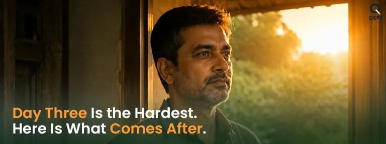 Indian man at a doorway in sunrise light — representing the difficult but determined early days of nicotine withdrawal