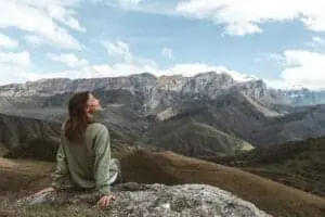 Person breathing deeply, feeling healthier after quitting smoking naturally."
