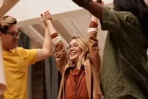 Person celebrating progress while staying motivated after quitting smoking