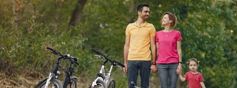 A family member smoking while the rest of the family looks concerned, highlighting the effect of smoking on loved ones."