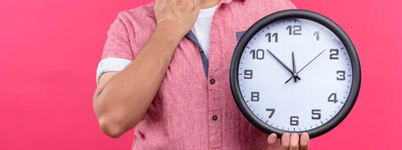 A clock dissolving into smoke, showing how smoking wastes valuable time