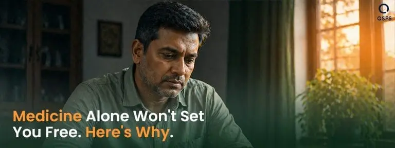 ndian man sitting thoughtfully at home — representing the decision to understand stop smoking medicine properly before choosing a path