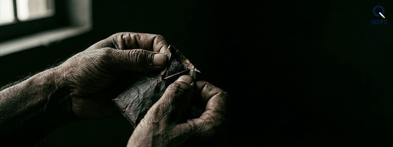 A green leaf emerging from darkness — representing recovery and healing after quitting chewing tobacco and gutka